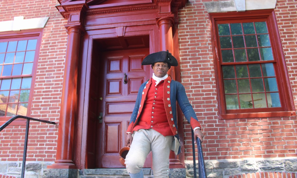 After a yearlong renovation, the Old Barracks Museum is open to the public, to celebrate America’s 250th anniversary. The historic site features Revolutionary War reenactors like military interpreter Daryian Kelton. Photo credit: Lucy Harper / NJ State House News Service