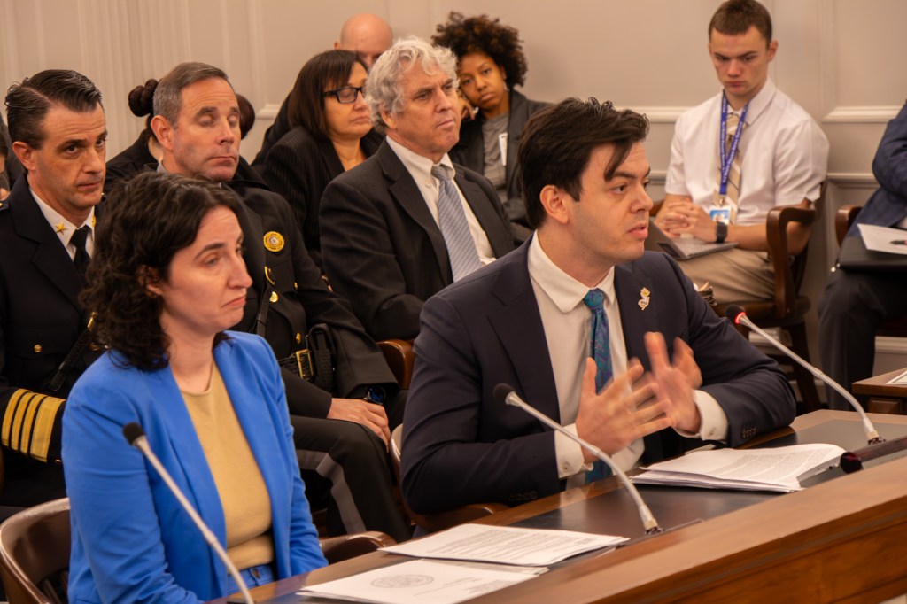 Dillon Reisman, staff attorney of the ACLU of New Jersey, discusses his concerns about law enforcement use of facial recognition technology with Assembly Member Paul
Kanitra, a Republican from Brick, at the Assembly Public Safety and
Preparedness Committee meeting on Oct. 19.
Photo credit: Aidan Vanhoof/NJ State House News Service.